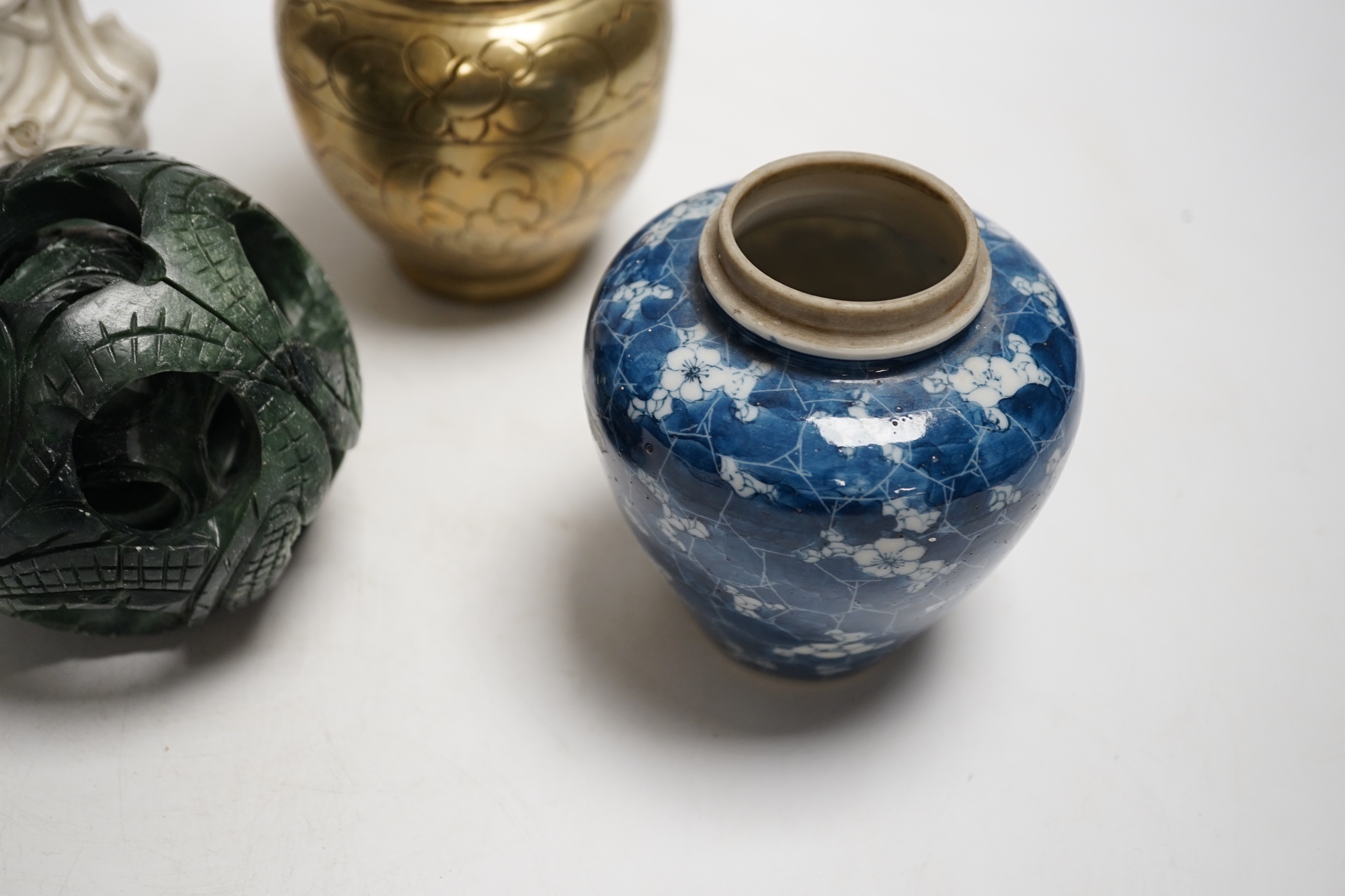 A Chinese blanc de chine model of Guanyin, a bronze vase, a hardstone concentric ball, a blue jar and dish (5), tallest 25cm